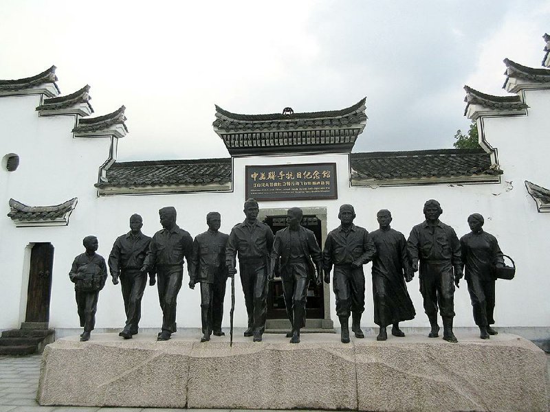A bronze sculpture representing five Doolittle Raiders and five Chinese rescuers is outside Jiangshan Raider Memorial Hall. 