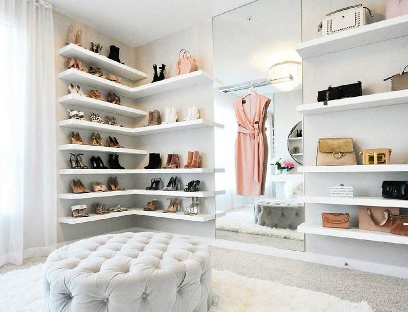 This closet designed for lifestyle blogger Jessi Malay by LAloset Design, features floating shelves to display her collection of shoes. 

