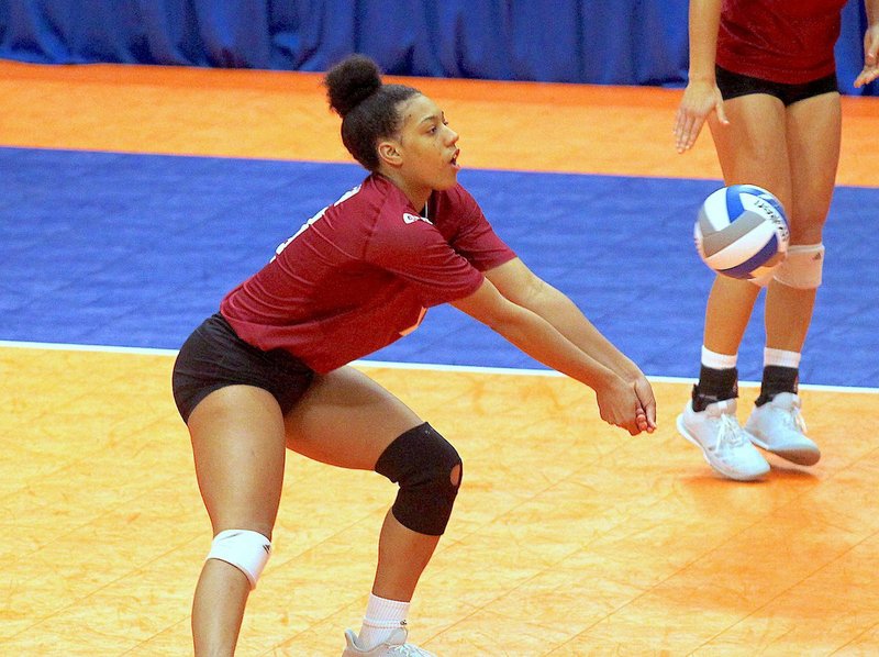 The Sentinel-Record/Richard Rasmussen FIRST IMPRESSION: Henderson State junior Courtney Bolf, a unanimous selection to the All-Great American Conference First Team, performs a dig Thursday during a straight-set victory against Oklahoma Baptist in the quarterfinals of the 2018 GAC Volleyball Championships tournament at Bank OZK Arena.