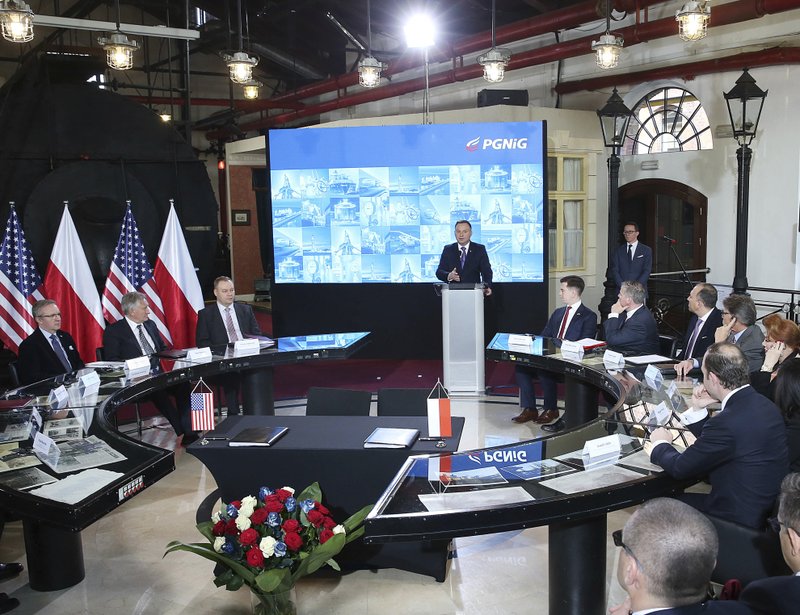 Poland's President Andrzej Duda speaks about increasing the nation's energy security during a ceremony in which Poland's main gas company PGNiG signed a long-term deal for liquefied gas deliveries with the U.S. firm Chenier, in Warsaw, Poland, Thursday, Nov. 8, 2018. (AP Photo/Czarek Sokolowski)