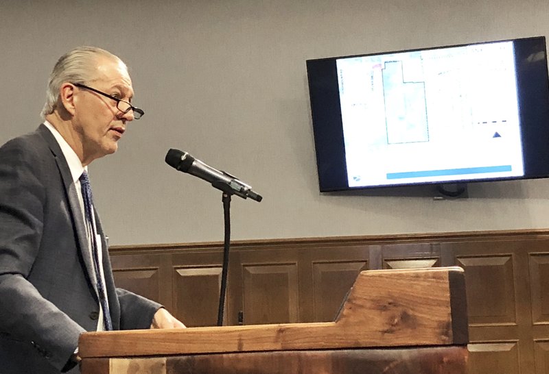 NWA Democrat-Gazette/STACY RYBURN Robert Rhoads, an attorney representing the developer of a patch of land near Rupple Road, speaks Thursday to the Fayetteville City Council. The council approved measures that will fill the gap of Rupple between Tanyard Drive and Weir Road.
