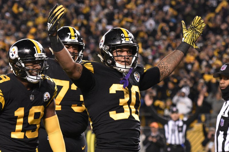 Pittsburgh Steelers running back James Conner (30) celebrates his touchdown against the Carolina Panthers during the first half of an NFL football game in Pittsburgh, Thursday, Nov. 8, 2018. (AP Photo/Don Wright)