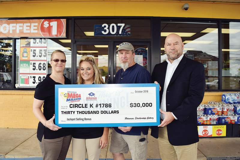 The Circle K gas station, at 307 Rock St. in Sheridan, recently received a $30,000 commission check from the Arkansas Lottery Commission. From left are Laura Picklesimer, Circle K marketing manager; Mary Steitler, store manager; Timothy Burdess; and Bishop Woosley, Arkansas Scholarship Lottery director.