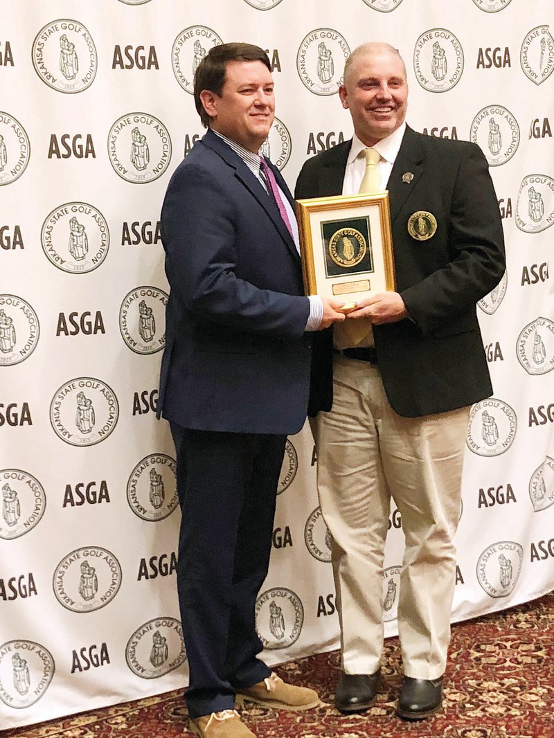Trey Schaap, left, of Maumelle receives the Mid-Senior Player of the Year award from Arkansas Golf Hall of Famer Wes McNulty.