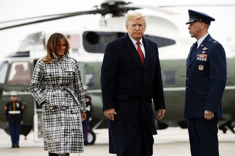 President Donald Trump and first lady Melania Trump board Air Force One on Friday at Andrews Air Force Base in Maryland as they head to Paris, where they will participate in World War I commemorations. 