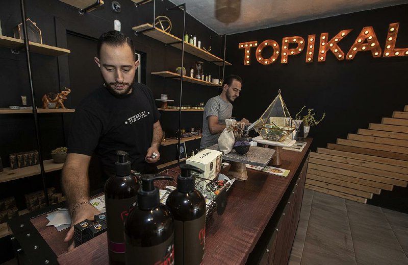 Greg Avetisyan (right) and his brother Gary Avetisyan (left) in Topikal, their CBD store on Ventura Boulevard in Tarzana, Calif., last month. 