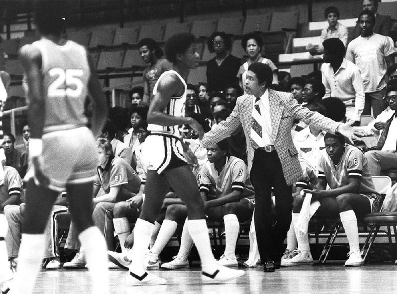 Former Little Rock Hall coach Oliver Elders (right) will be recognized by the school Monday night with a reception and a ceremony between the Warriors’ girls and boys games against Van Buren. 