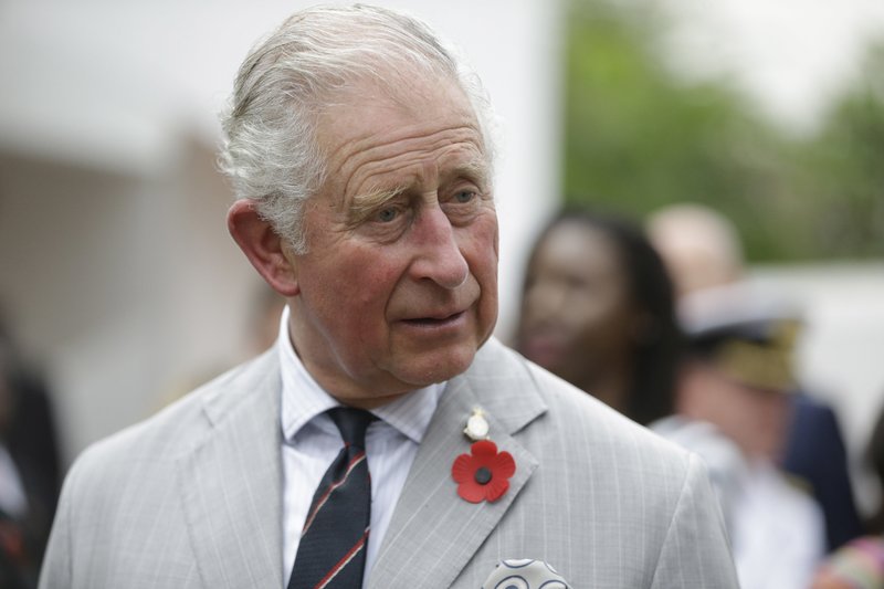 Britain's Prince Charles speaks to fashion designers during a visit to the British Council Arts Festival in Lagos, Nigeria, Wednesday Nov. 7, 2018. (AP Photo/ Sunday Alamba)