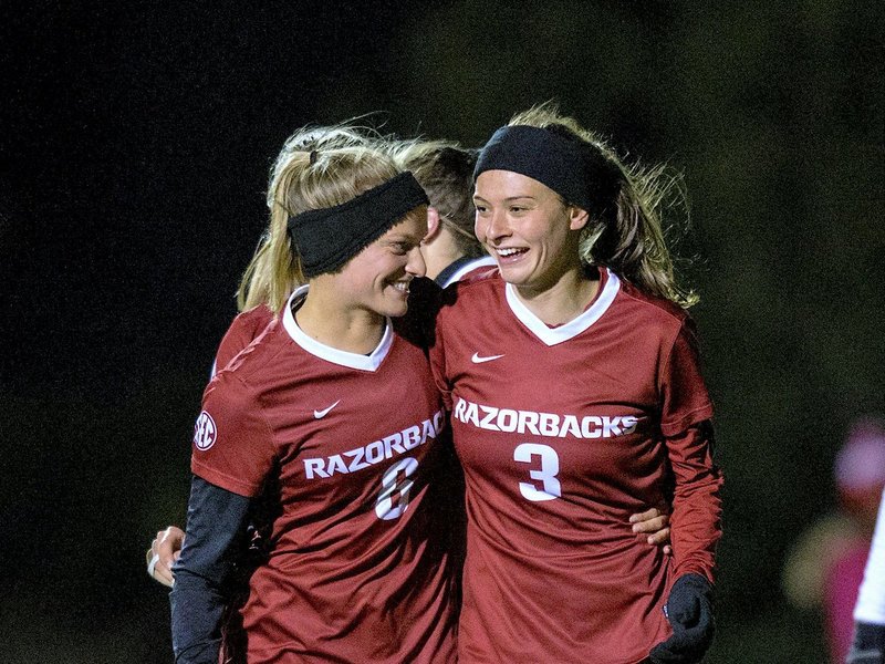 NWA Democrat-Gazette/BEN GOFF @NWABENGOFF
Carly Hoke (left) of Arkansas congratulates Tori Cannata after she scored the third goal for Arkansas in the first half vs Arkansas Little Rock Friday, Nov. 9, 2018, during the first round of the NCAA Tournament at Razorback Field in Fayetteville. 