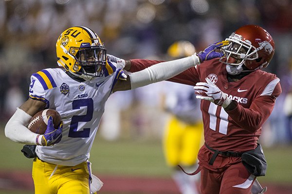 Ryan Pulley, Arkansas cornerback, forces Justin Jefferson, LSU wide receiver, out of bounds after a catch in the third quarter Saturday, Nov. 10, 2018, at Reynolds Razorback Stadium in Fayetteville.