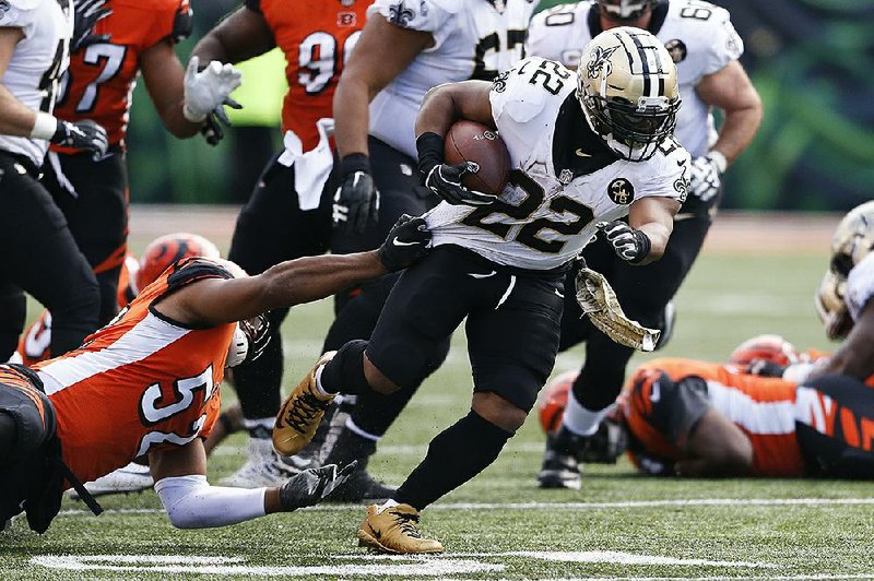New Orleans Saints running back Mark Ingram (22) rushed for 104 yards and caught a 28-yard touch-down pass from Drew Brees in the Saints’ 51-14 victory over the Cincinnati Bengals on Sunday.