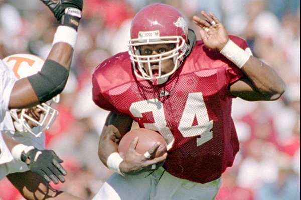 Arkansas running back Madre Hill evades a Tennessee defender during a game Saturday, Oct. 23, 1995, in Fayetteville. (AP Photo/Danny Johnston)