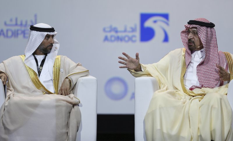 UAE Energy Minister Suhail al-Mazrouei, left, listens to Khalid Al-Falih, Saudi Energy and Oil Minister, in the opening ceremony of the Abu Dhabi International Exhibition & Conference, ADIPEC, in Abu Dhabi, United Arab Emirates, Monday. OPEC and allied oil-producing countries likely need to cut crude supplies to rebalance the market after proposed U.S. sanctions on Iran failed to cut Tehran's ouput, top Saudi and Emirati energy officials said Monday. (AP Photo/Kamran Jebreili)

