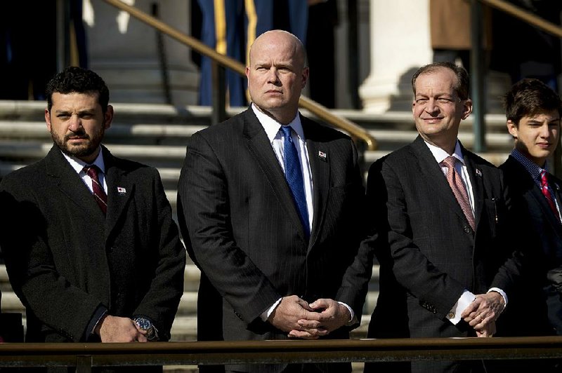 Matt Whitaker (center), the acting U.S. attorney general, attends a Veterans Day wreath-laying ceremony Sunday at Arlington National Cemetery in Virginia. 