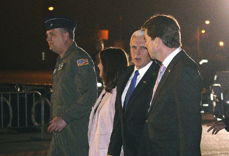 Vice President Mike Pence (second from right) and his wife Karen are escorted to a waiting helicopter by the U.S. Ambassador to Japan William Hagerty (right) at Yokota Air Base in Fussa on the outskirts of Tokyo, on Monday. 