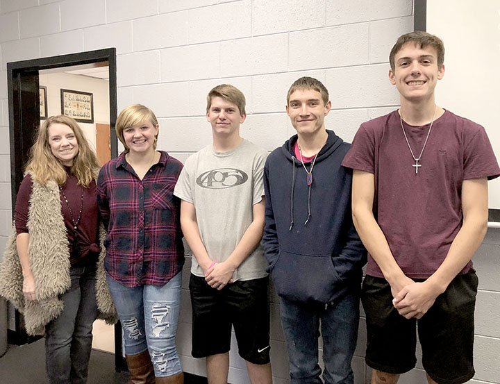 LYNN KUTTER ENTERPRISE-LEADER Courtney Jones, principal of Lincoln High School, left, stands with members of the school's mountain bike riding team: Serenity Millwood, Dalton Lankford, Kevin Williams and Chase Hutchens. The team talked about their sport at the Lincoln Area Kiwanis Club meeting last week.