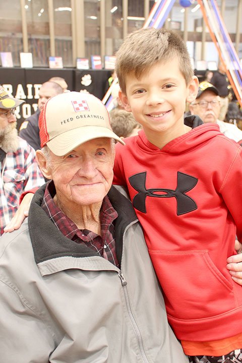 LYNN KUTTER ENTERPRISE-LEADER Landon Jordan, a fifth-grader at Prairie Grove Middle School, sat with his great-grandfather at the Veterans Assembly on Friday morning. Clem Tollett served in the U.S. Army from 1955 to 1963.