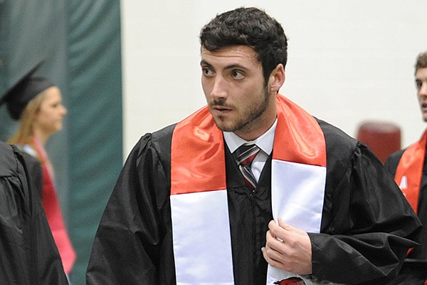 Former Arkansas quarterback Brandon Allen prepares to go through a commencement ceremony on Saturday, Dec. 20, 2014, in Fayetteville. Allen, who enrolled at the University of Arkansas in 2011, is one of the athletes whose graduation is reflected in the latest NCAA Graduation Success Rate data. 