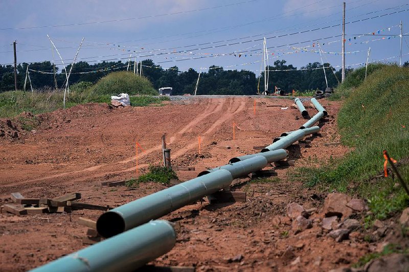 Sections of pipe sit on top of wooden supports in August at a construction site for a natural gas liquids pipeline project in Pennsylvania. Forecasts calling for a cold snap across much of the Northeast and South helped push the price of natural gas sharply higher on Wednesday. 
