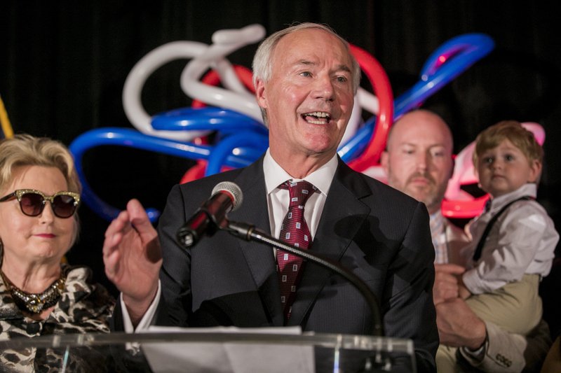 ELECTION VICTORY: In this Nov. 6, 2018 file photo, Gov. Asa Hutchinson speaks at his election night victory rally in Little Rock, Ark. Hutchinson on Wednesday, Nov. 14, 2018, proposed increasing state spending in the fiscal year that begins July 1 by more than $129 million. The proposal includes a $111 million plan to cut the state's top income tax rate over the next two years, simplifying tax tables and brackets and increasing the standard deduction. (AP Photo/Gareth Patterson, File)