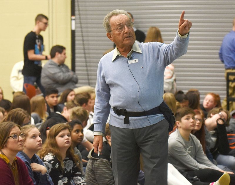 NWA Democrat-Gazette/FLIP PUTTHOFF Pieter Kohnstam talks to students Wednesday about his experiences fleeing Germany during the Holocaust.