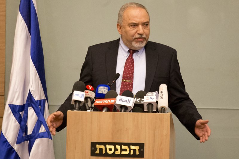 Israeli Defense Minister Avigdor Lieberman delivers a statement at the Knesset, Israel's Parliament, in Jerusalem, Wednesday, Nov. 14, 2018. Lieberman announced his resignation Wednesday over the Gaza cease-fire, making early elections likely. 