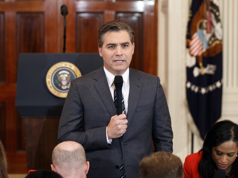 FILE - In this Nov. 7, 2018, file photo, CNN journalist Jim Acosta does a standup before a new conference with President Donald Trump in the East Room of the White House in Washington. CNN sued the Trump administration Tuesday, demanding that correspondent Jim Acosta&#x2019;s credentials to cover the White House be returned because it violates the constitutional right of freedom of the press. (AP Photo/Evan Vucci, File)