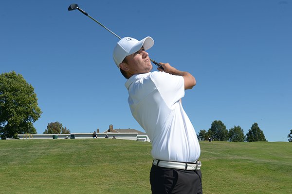 Fayetteville senior Denver Davis hits balls Thursday, Sept. 27, 2018, from the driving range during practice at Fayetteville Country Club.