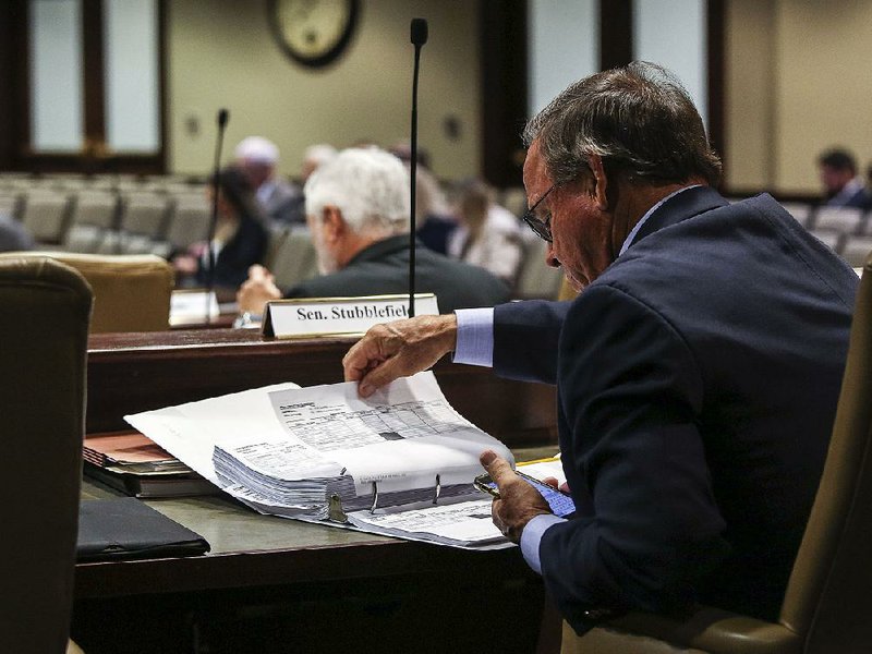 State Sen. Gary Stubblefield, R-Branch, studies the proposed fiscal 2020 budget Thursday as the Joint Budget Committee meets at the Multi-Agency Complex on the state Capitol grounds. 