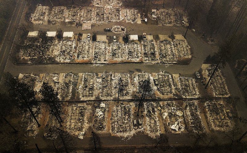 An aerial view Thursday shows a small part of the devastation in Paradise, Calif., from the Nov. 8 wildfire that has left at least 63 people dead, hundreds unaccounted for and thousands of homes destroyed. The city’s carefully designed evacuation plan that quickly gave way to a panicked exodus has authorities facing questions over their approach. 