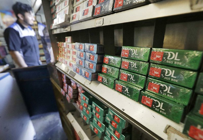 Packs of menthol cigarettes and other tobacco products line shelves at a store in San Francisco in May. 