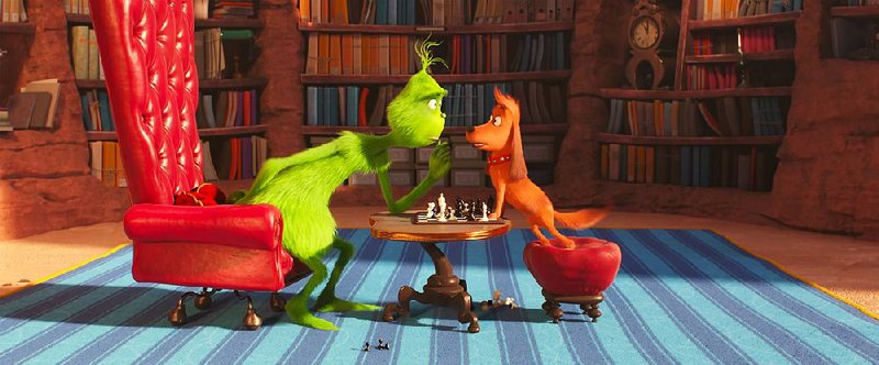 The Grinch, voiced by Benedict Cumberbatch, and his loyal dog Max play a game of chess in Universal Pictures’ new adaptation of Dr. Seuss’ The Grinch. The film came in first at last weekend’s box office and made about $66 million. 