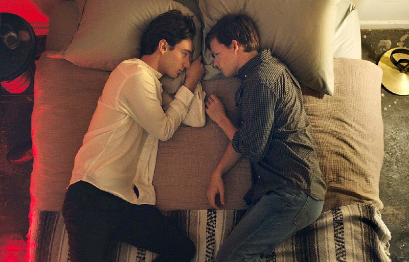 Xavier (Theodore Pellerin) and Jared (Lucas Hedges) spend a quiet moment together in Joel Edgerton’s non-hysterical family drama Boy Erased. 