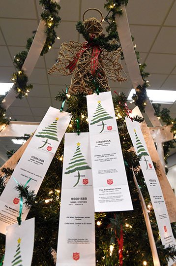 The Sentinel-Record/Grace Brown LITTLE ANGELS: Cards representing an "angel" up for adoption are displayed at the Hot Springs Mall on Thursday. An event to mark the start of this year's Angel Tree program will be held from 10 a.m. to noon today at the mall.