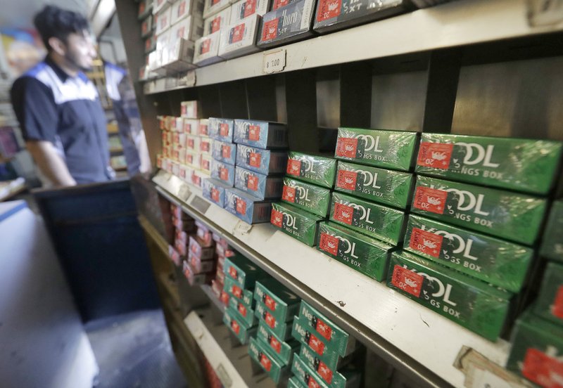 CORRECTS DATE OF ANNOUNCEMENT TO NOVEMBER, NOT MAY - FILE - This May 17, 2018 file photo shows packs of menthol cigarettes and other tobacco products at a store in San Francisco. On Thursday, Nov. 15, 2018, FDA Commissioner Dr. Scott Gottlieb pledged to ban menthol from cigarettes, in what could be a major step to further push down U.S. smoking rates. (AP Photo/Jeff Chiu)