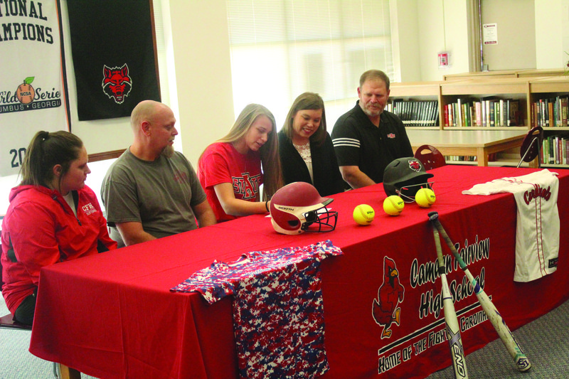 Camden Fairview student athlete Lexi Betts is joined by her parents and coaches as she signs her national letter of intent to continue her softball career with the Arkansas State Red Wolves. The signing was held at the CF High School library and was attended by Betts’ teammates, friends and family. Also, members of C.F. Administration were on hand to help with the celebration. Pictured from left is CF Head softball coach Kendra Center, Betts' father Chris, Betts, Betts' mother Donnie, and Arkansas State Head Softball Coach Keith Henson. 