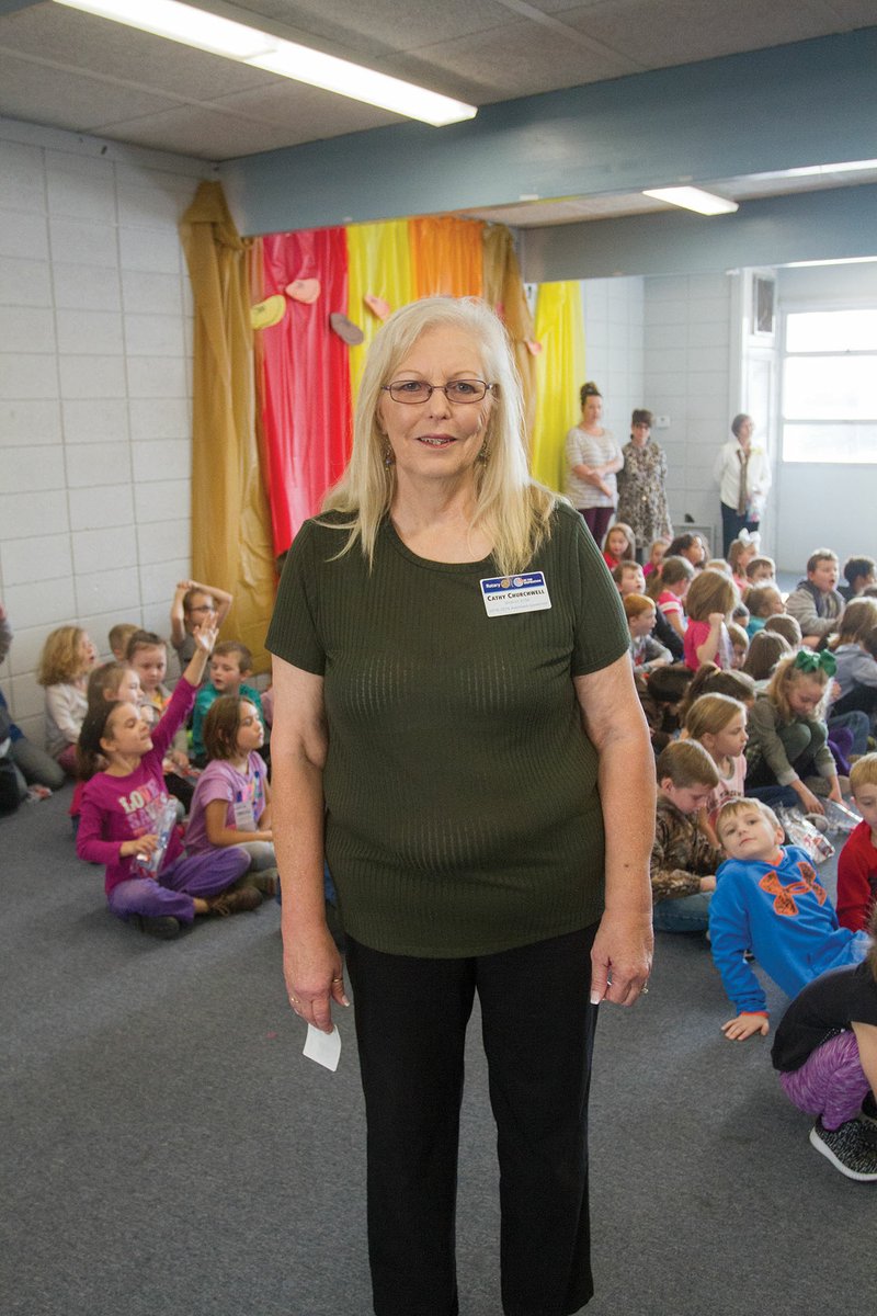 Cathy Churchwell, president of the Rotary Club of Bald Knob, stands in front of kindergartners at H.L. Lubker Elementary School in Bald Knob after the students were given toothbrushes and toothpaste as part of the Rotary Club’s Healthy Smiles Project. Churchwell, who lives in Griffithville, has been a member of the Bald Knob Rotary Club for 12 years.