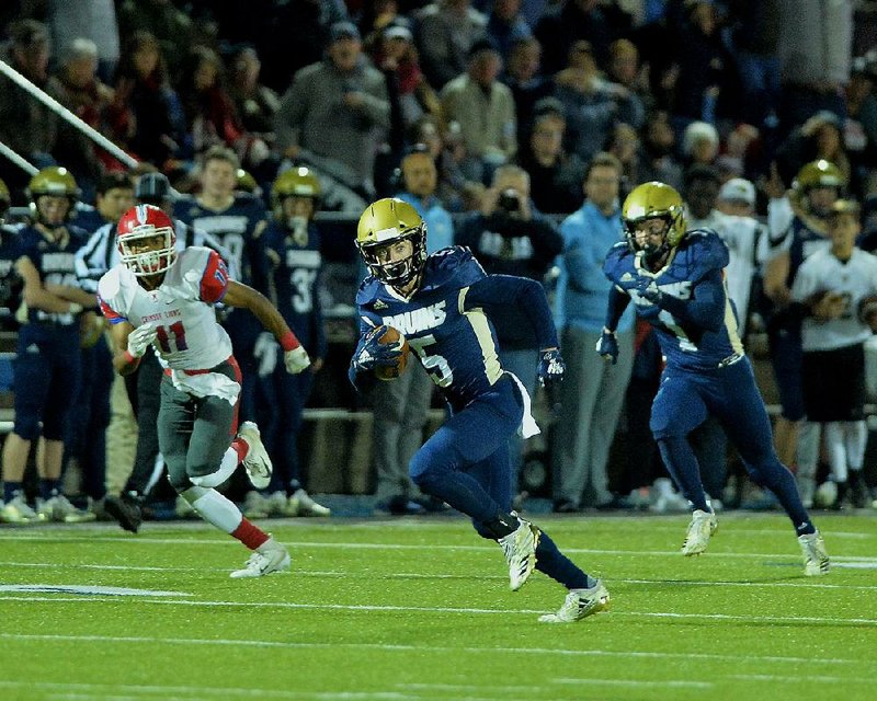 Pulaski Academy receiver John David White (5) runs for a touchdown Friday during the Bruins’ 58-8 victory over Little Rock McClellan in the Class 5A quarterfinals. Pulaski Academy will host Harrison next week in the semifinals. 