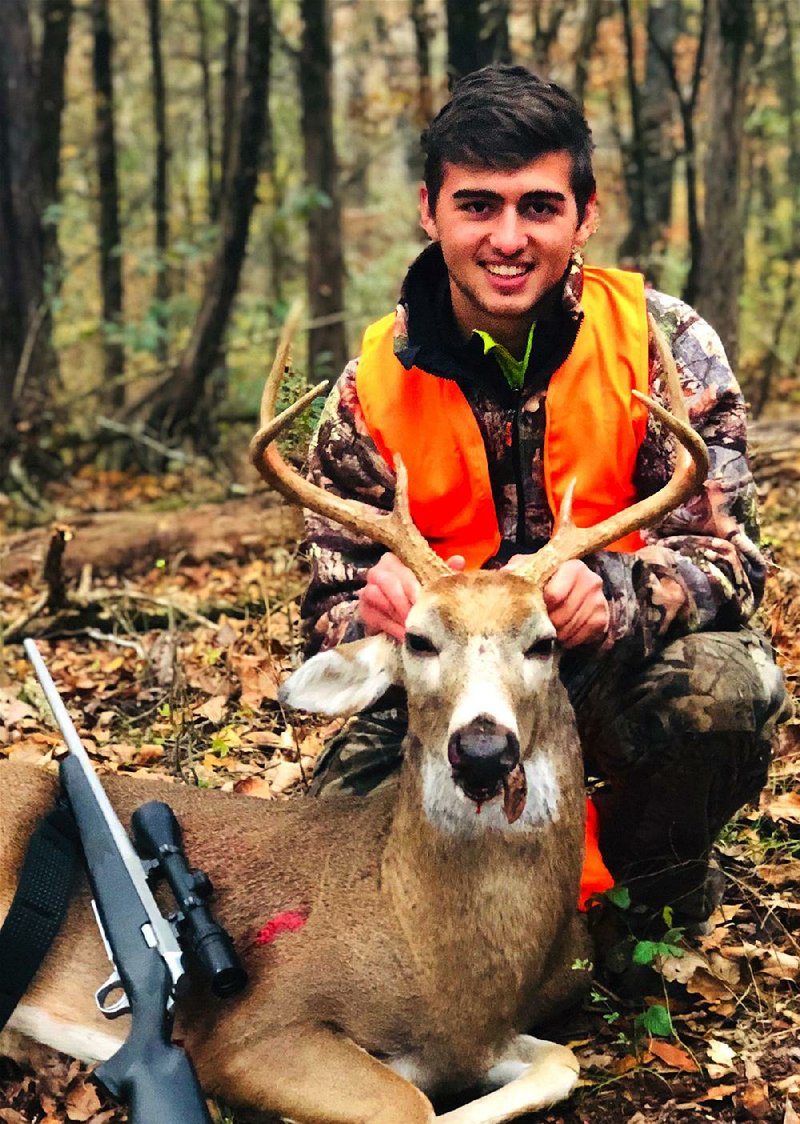 Guilherme Ribeiro, 17, an exchange student from Itajai, Brazil, was initiated into Arkansas’ hunting culture Nov. 11 when he killed this buck while hunting with his exchange host, Brad Kohler.