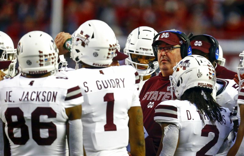 Mississippi State head coach Joe Moorhead talks with players in a timeout during the second half of an NCAA college football game against Alabama, Saturday, Nov. 10, 2018, in Tuscaloosa, Ala. (AP Photo/Butch Dill)