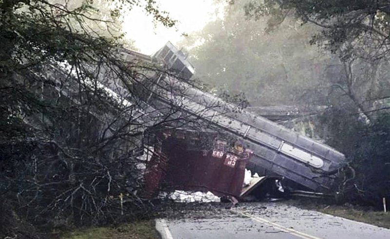 This photo provided by Montezuma police shows a train derailment on Saturday, Nov. 17, 2018 in Byromville, Ga. CSX Railroad said the cars derailed around 7 a.m. Saturday in Byromville, roughly 55 miles south of Macon. The exact number of cars involved is unclear. CSX says "several" cars derailed. The town's fire chief, Brett Walls, tells WMAZ-TV that between 15 and 30 cars fell from a bridge onto Georgia Highway 90. (Montezuma police via AP)