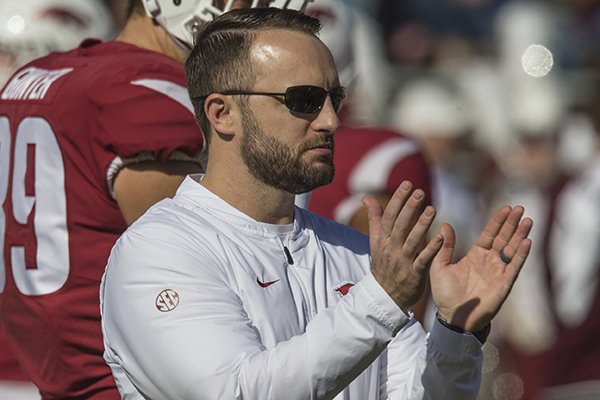Arkansas offensive coordinator Joe Craddock claps during warmups prior to a game against Mississippi State on Saturday, Nov. 17, 2018, in Starkville, Miss. 