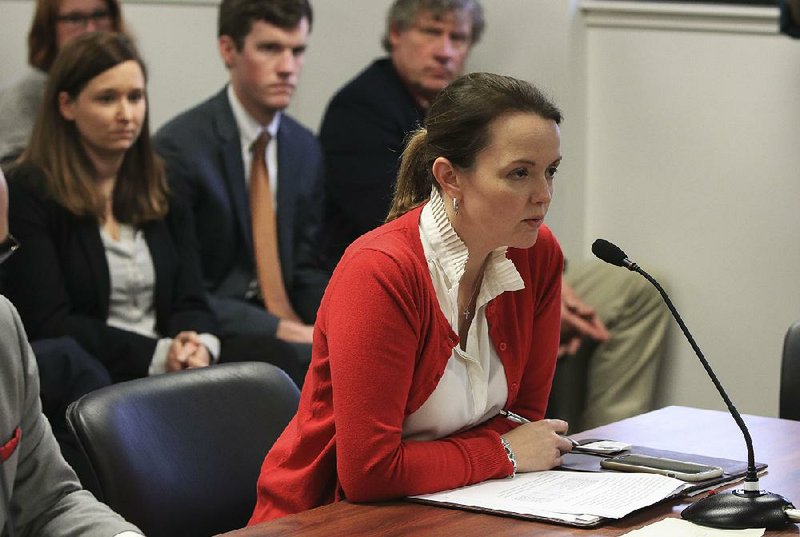 In this Feb. 28, 2018 file photo, Mary Robin Casteel, head of the Arkansas Alcoholic Beverage Control Administration, reads the names of the top applicants for cannabis cultivation centers in Little Rock at a meeting of the state Medical Marijuana Commission. Casteel will begin her new role as Gov. Asa Hutchinson's chief legal counsel Monday. 
