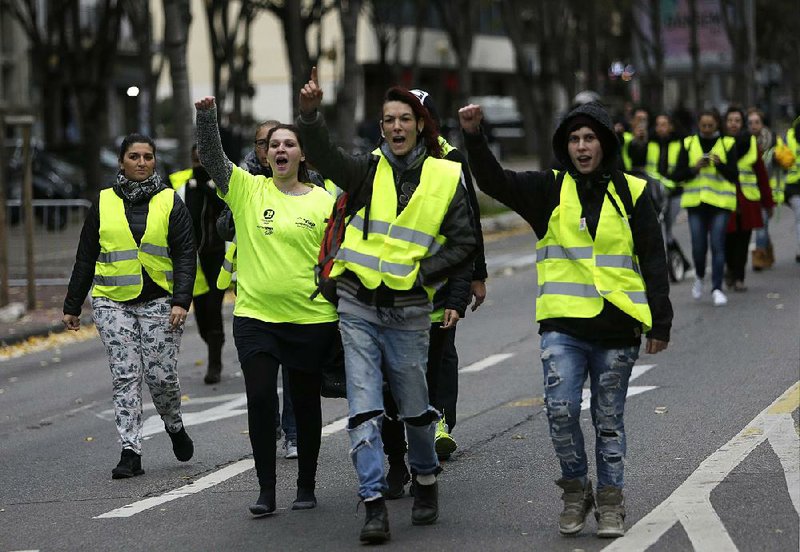 French protesters gather in Marseille on Saturday for a demonstration stemming from the government’s decision to raise fuel taxes. 