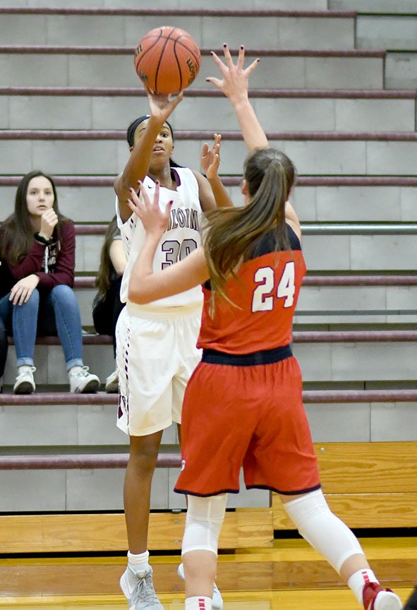 Bud Sullins/Special to Siloam Sunday Siloam Springs junior Jael Harried launches a 3-pointer over Providence Academy's Lauren Wyand during the first quarter of the Lady Panthers' season-opener Friday at Panther Arena.