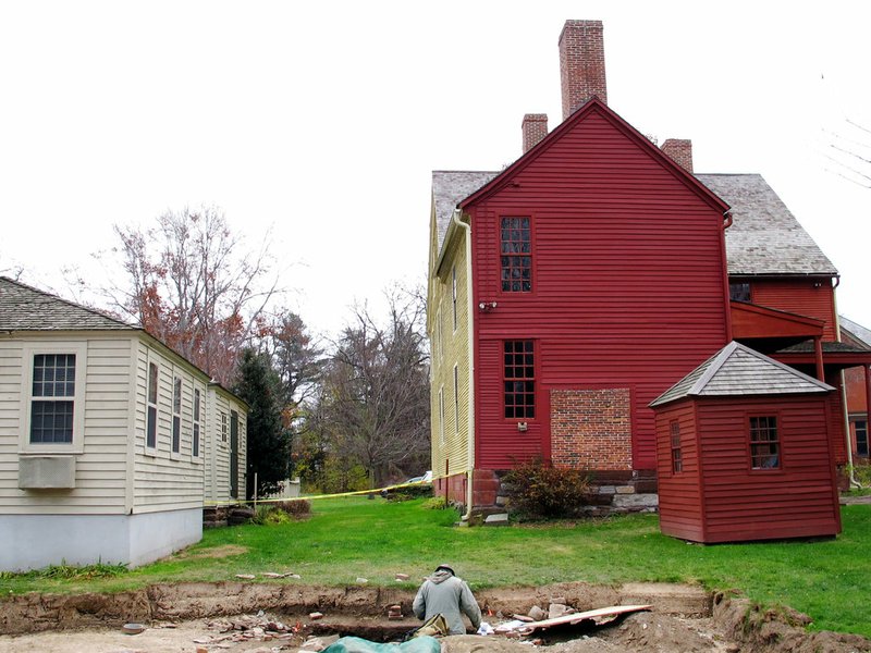 In this Thursday, Nov. 15, 2018, photo archaeologist Will Sikorski works at a dig site in Wethersfield, Conn. Experts have unearthed artifacts they believe date to the 1630s in Wethersfield, which has declared itself the state's "most ancient town," founded in 1634. But a few miles north, Windsor boasts it is the state's "first town" settled in 1633. (AP Photo/Dave Collins)