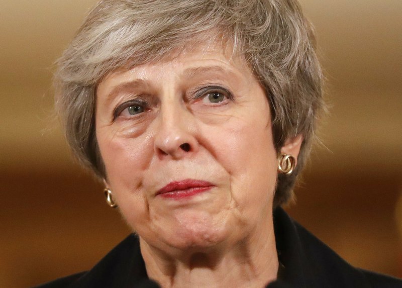 Britain's Prime Minister Theresa May speaks during a press conference inside 10 Downing Street in London, Thursday, Nov. 15, 2018. British Prime Minister Theresa May says if politicians reject her Brexit deal, it will set the country on "a path of deep and grave uncertainty." Defiant in the face of mounting criticism, May said Thursday she believed "with every fiber of my being" that the deal her government struck with the European Union was the right one. (AP Photo/Matt Dunham, Pool)