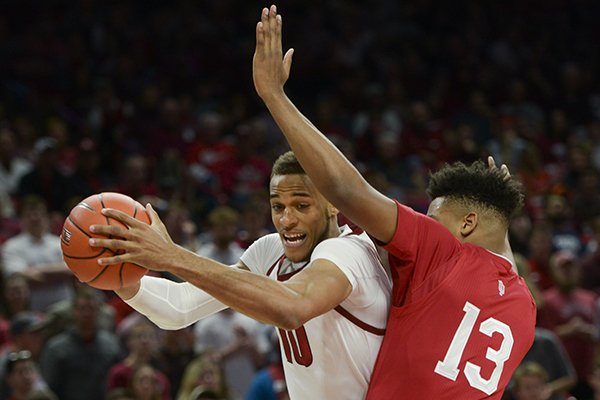 Arkansas forward Daniel Gafford (10) contacts Indiana forward Juwan Morgan (13) during a basketball game Sunday, Nov. 18, 2018, at Bud Walton Arena in Fayetteville.