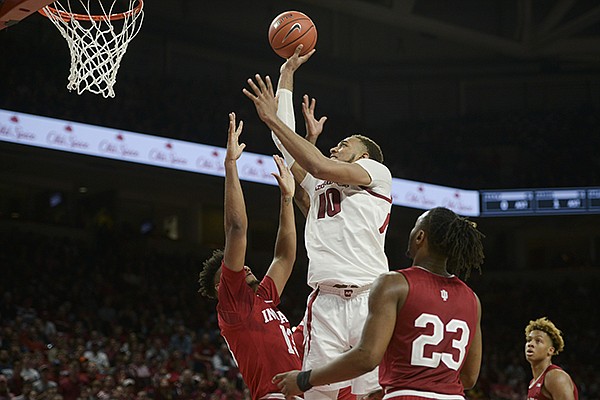 Arkansas' Daniel Gafford (10) goes up for a shot against Indiana defenders during a game Sunday, Nov. 18, 2018, in Fayetteville. 