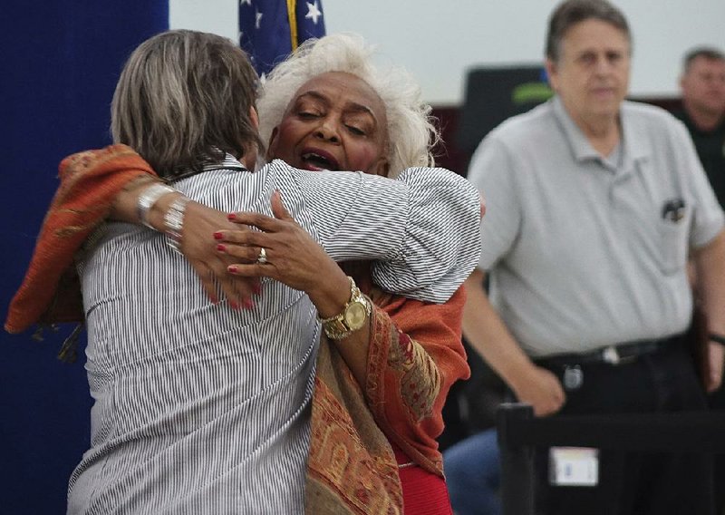Judge Betsy Benson (left) and Broward County election official Brenda Snipes hug Sunday at the county’s supervisor of elections office in Lauderhill, Fla. Broward County’s recount results were reported 52 minutes before the deadline, and Republican Rick Scott was confirmed as the winner in the Senate race.